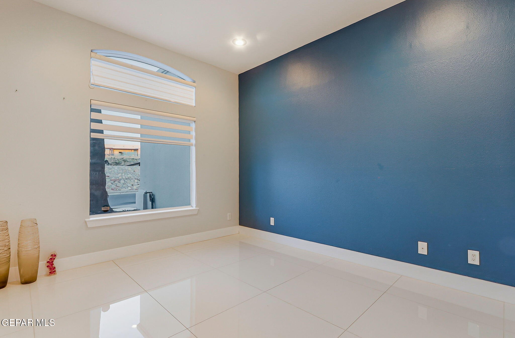 1297 Cypress Ridge Drive El Paso, TX 79912 - Photo 7 of 77 a view of an empty room with a window