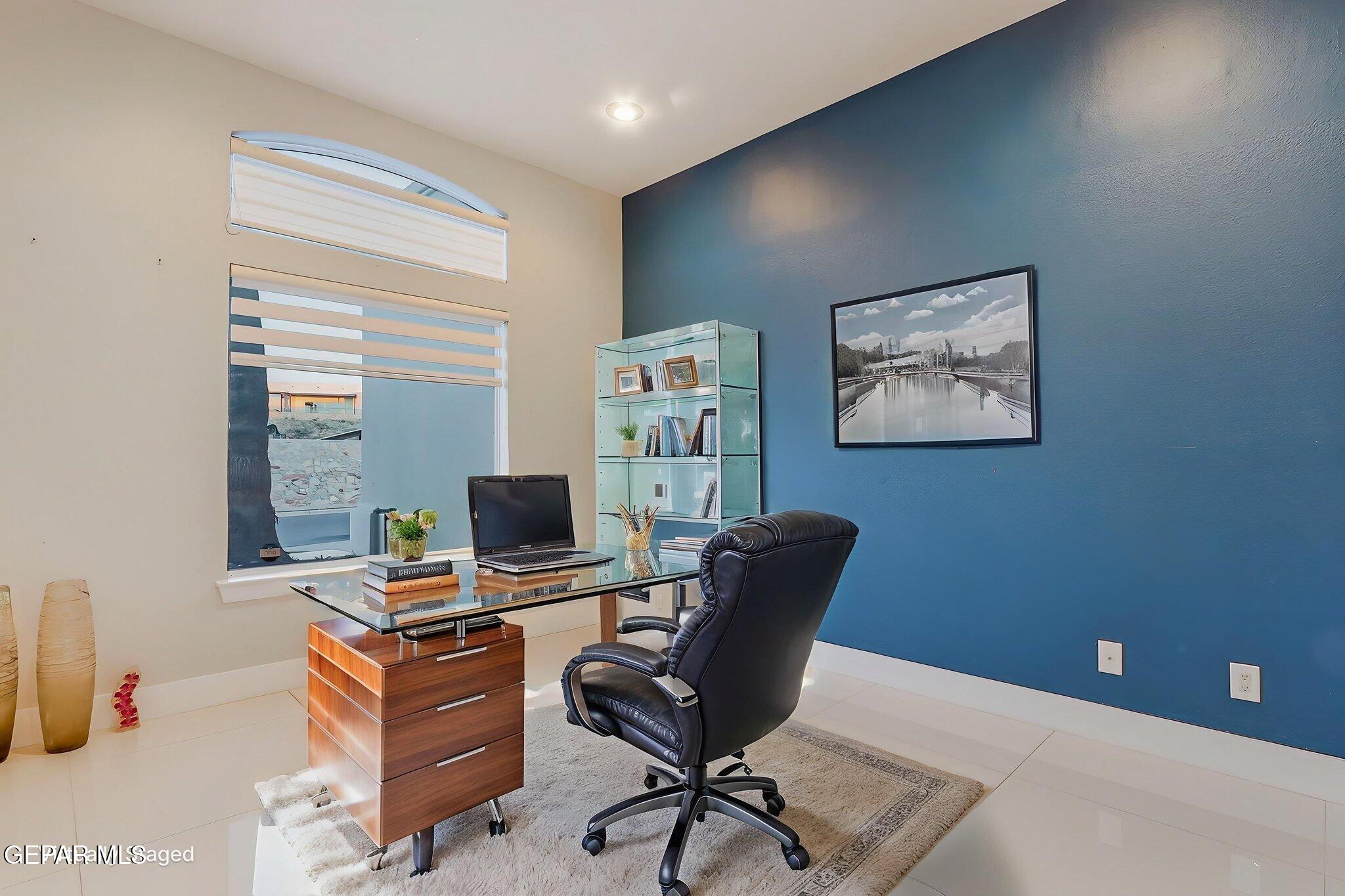 1297 Cypress Ridge Drive El Paso, TX 79912 - Photo 8 of 77 a view of a workspace with furniture and a window