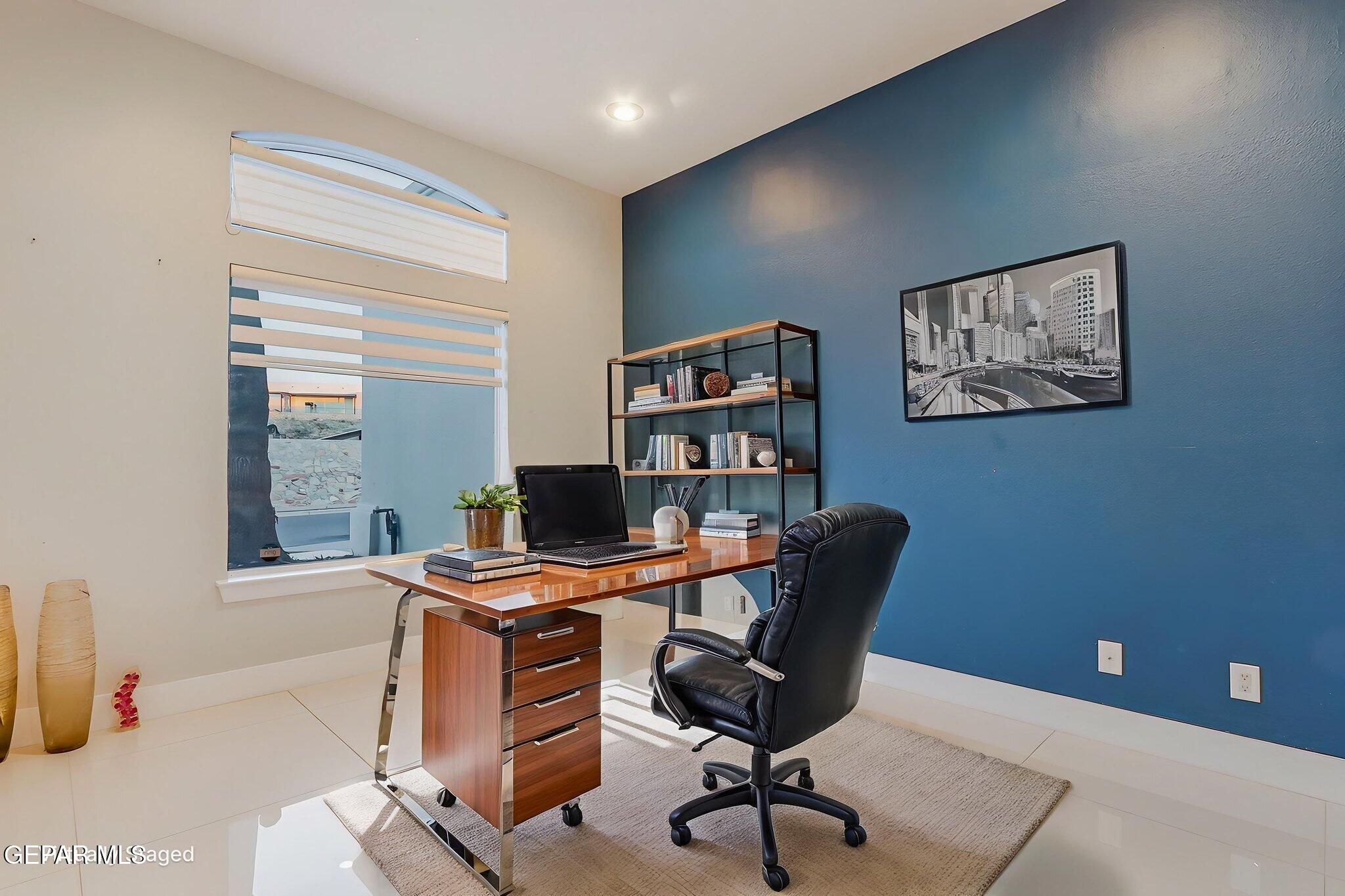 1297 Cypress Ridge Drive El Paso, TX 79912 - Photo 9 of 77 a view of a workspace with furniture and a window