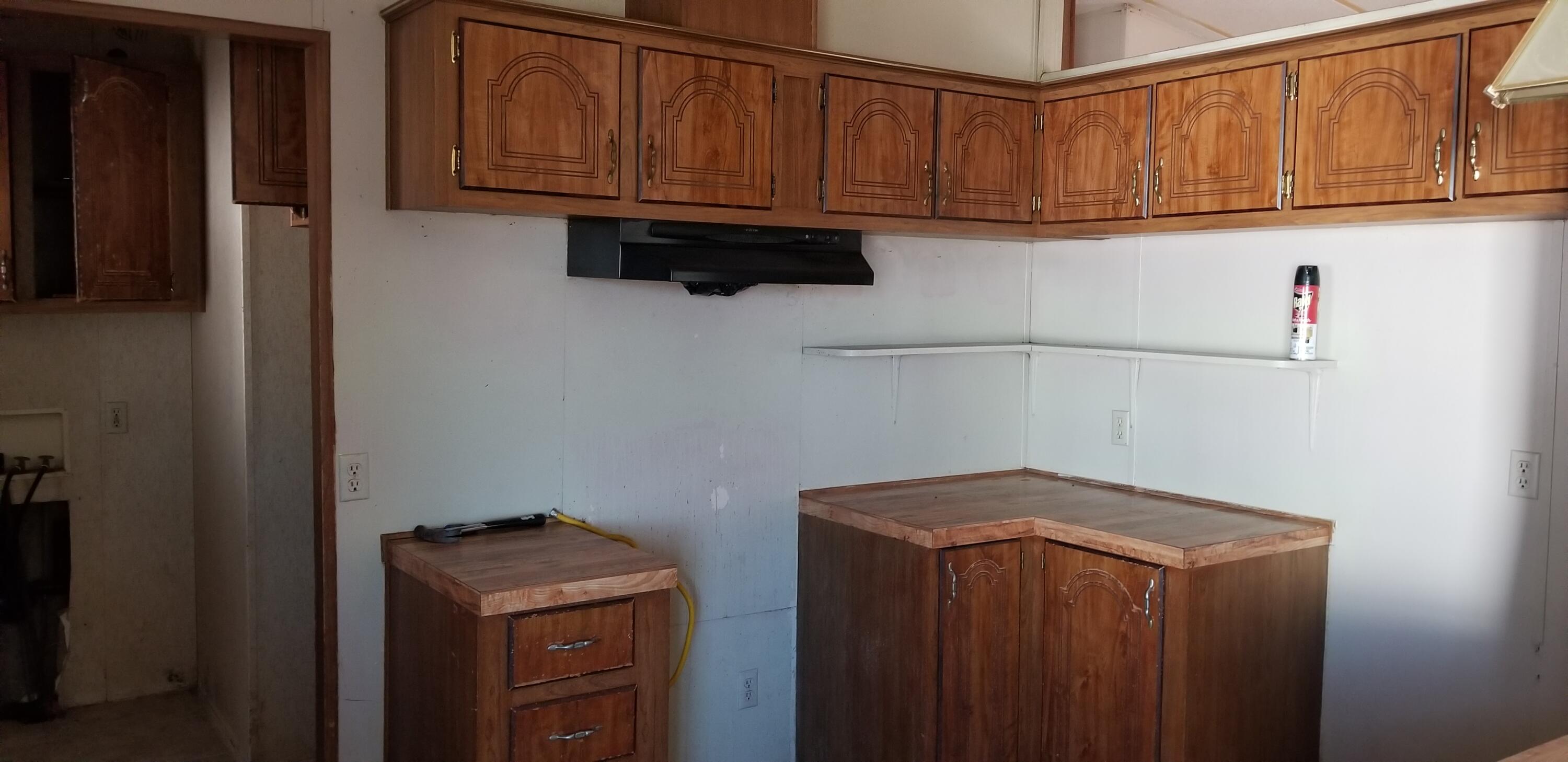 2331 Shore Isle Avenue Thermal, CA 92274 - Photo 11 of 14 a view of storage and utility room with washer and dryer