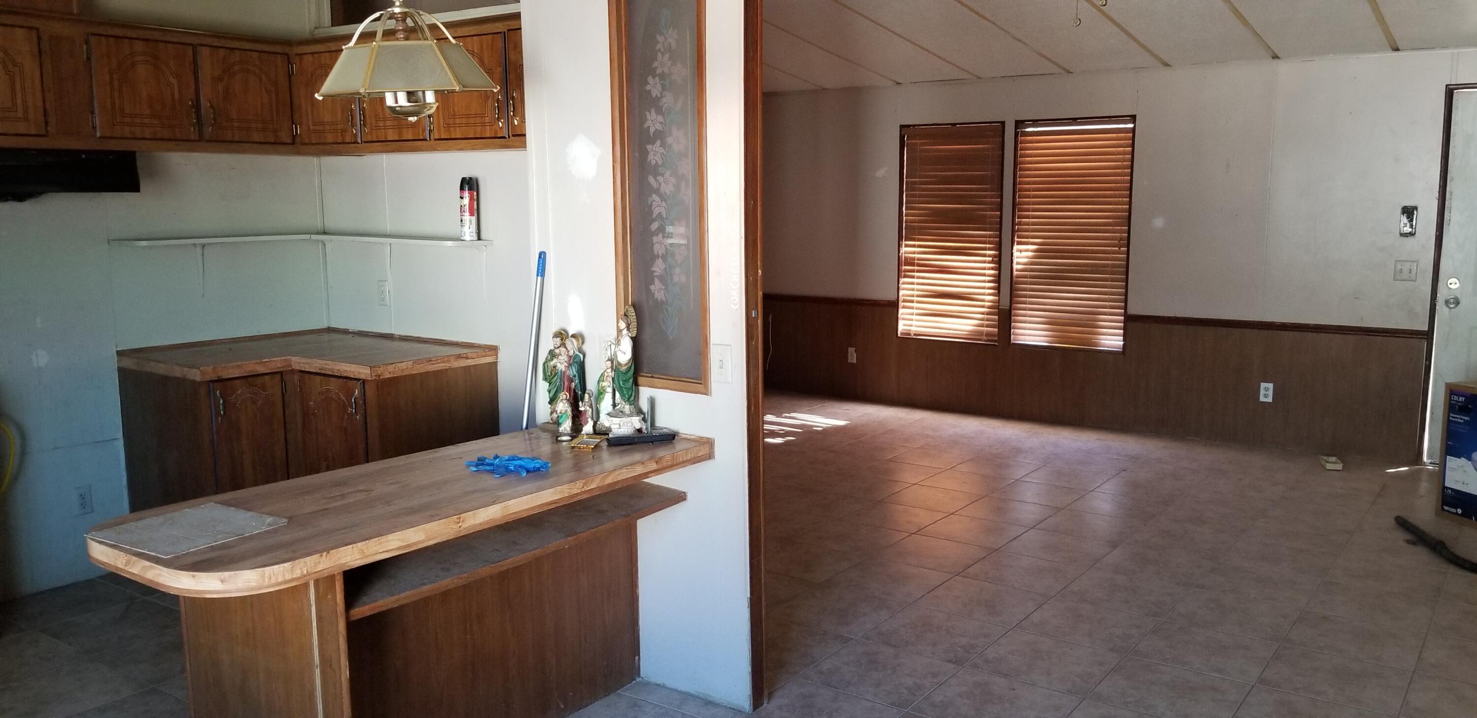 2331 Shore Isle Avenue Thermal, CA 92274 - Photo 6 of 14 a kitchen with a sink and a refrigerator