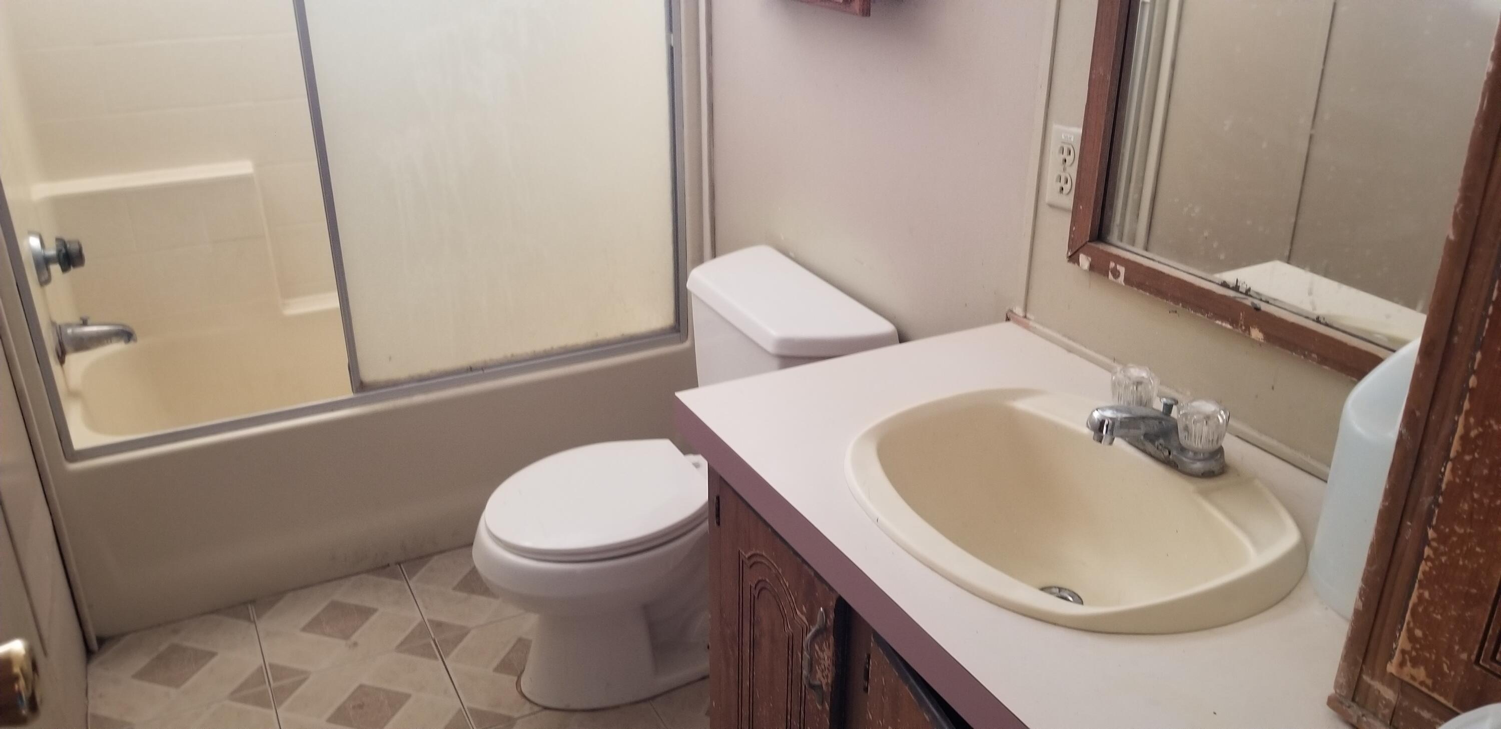 2331 Shore Isle Avenue Thermal, CA 92274 - Photo 7 of 14 a bathroom with a sink and a toilet