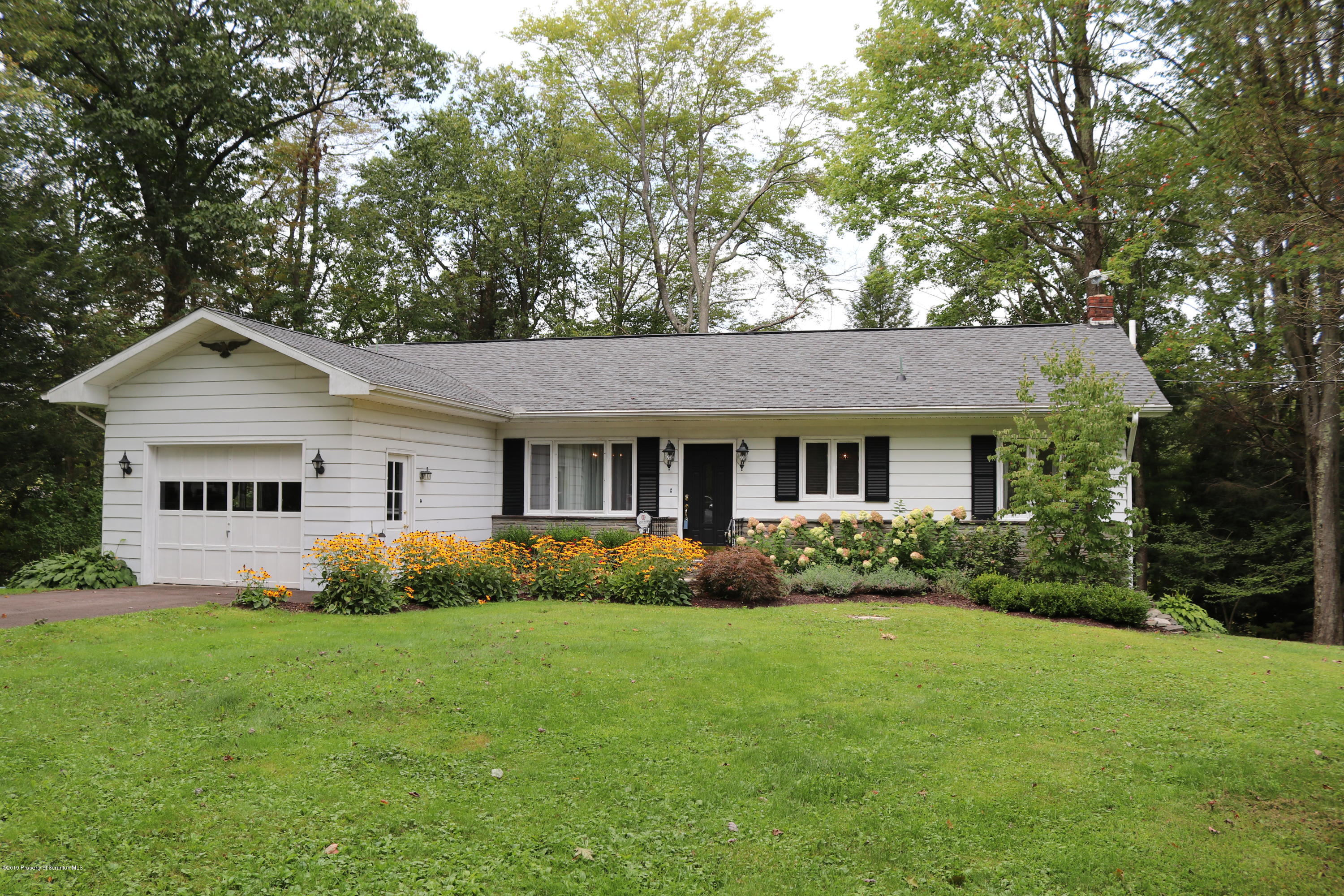 29 Parry Road Moscow, PA 18444 - Photo 2 of 38 a front view of house with yard and green space