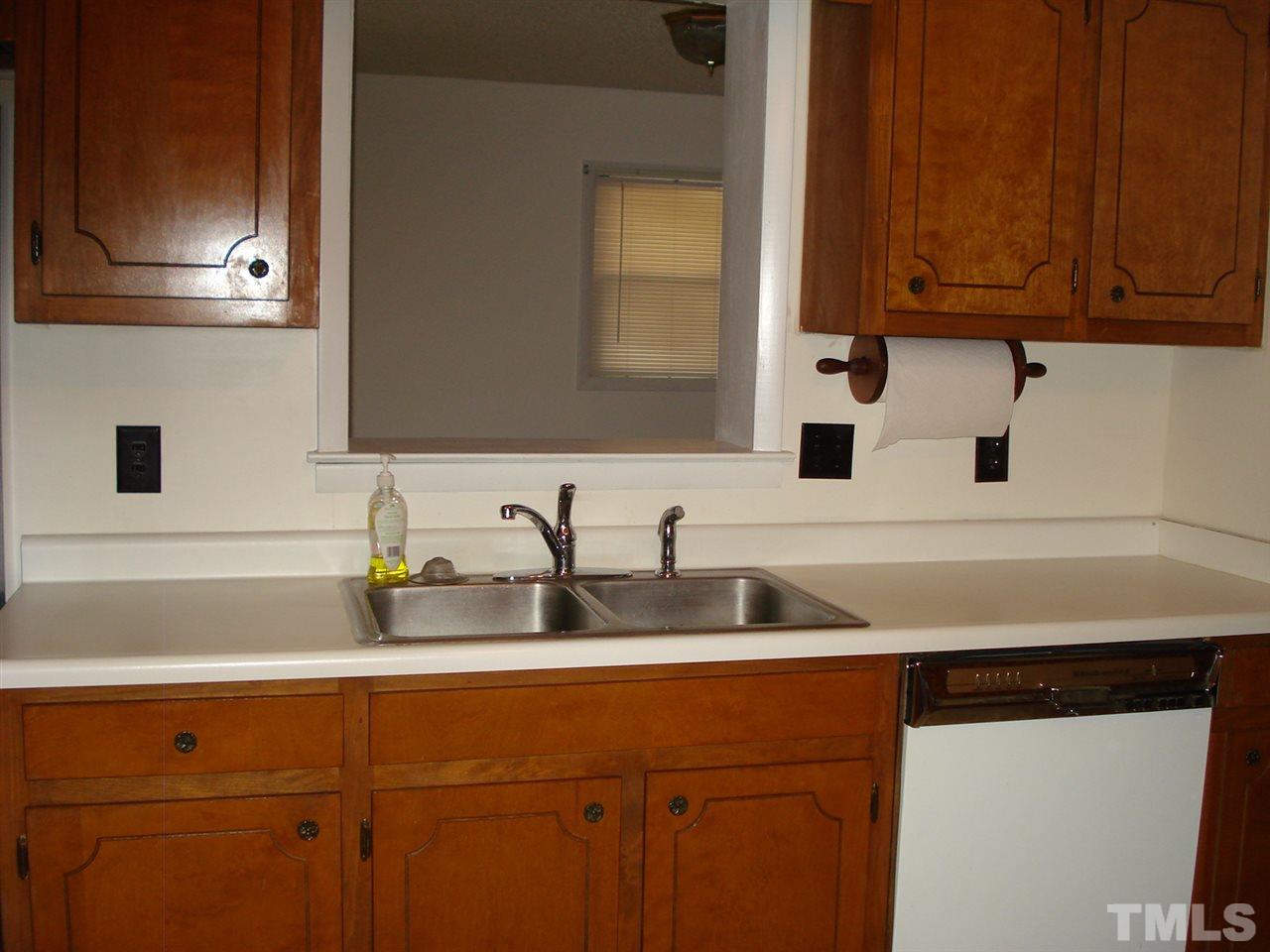 1042 Core Road Dunn, NC 28334 - Photo 22 of 25 a kitchen with a sink and cabinets