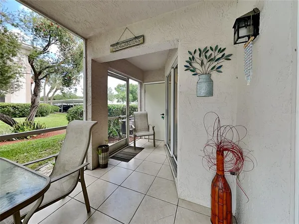 a room with furniture and a floor to ceiling window