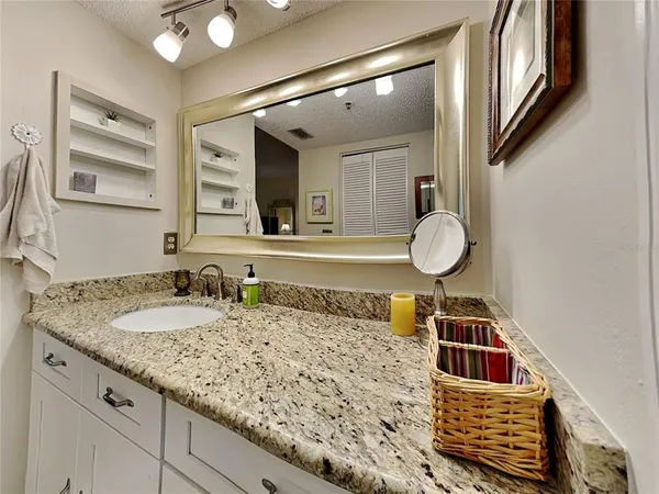a kitchen with stainless steel appliances and white cabinets