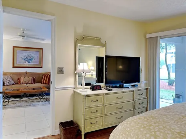 a bathroom with a sink vanity mirror and toilet