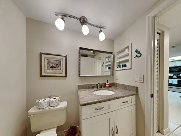 a living room with fireplace furniture and a chandelier
