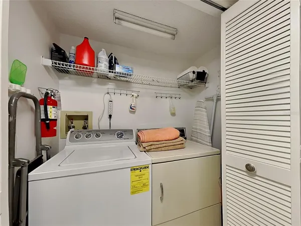 a view of an chairs and table in the patio