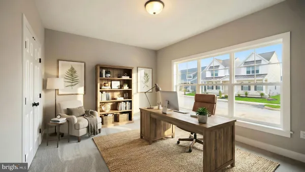 a living room with furniture a rug and a window