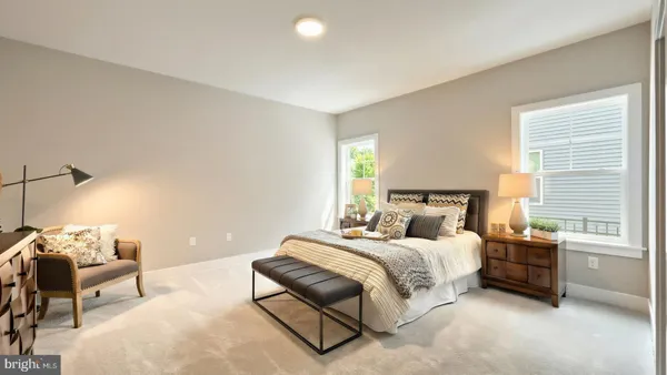 a bedroom with a bed and a couch
