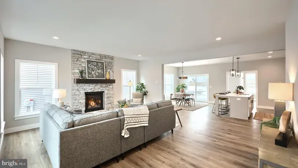 a living room with furniture and fireplace