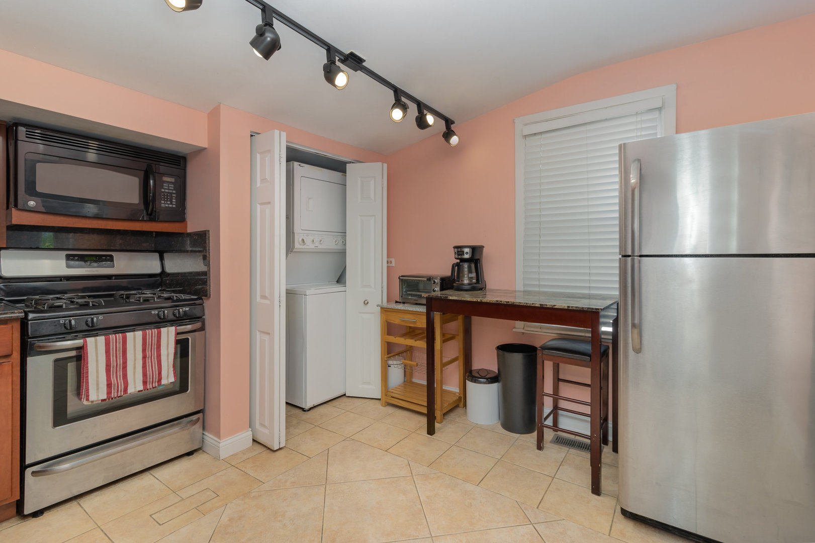 2121 Pine Road Homewood, IL 60430 - Photo 6 of 20 a kitchen with stainless steel appliances a refrigerator and a stove top oven