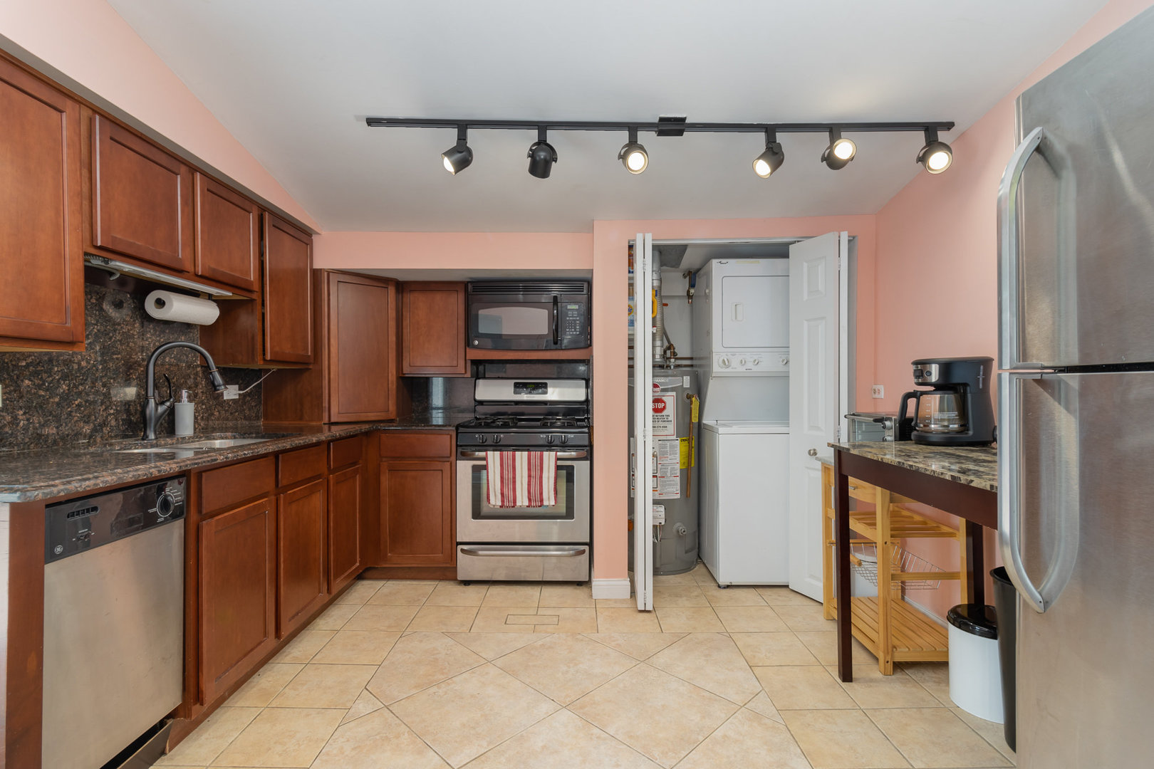 2121 Pine Road Homewood, IL 60430 - Photo 7 of 20 a kitchen with granite countertop a refrigerator and a stove top oven