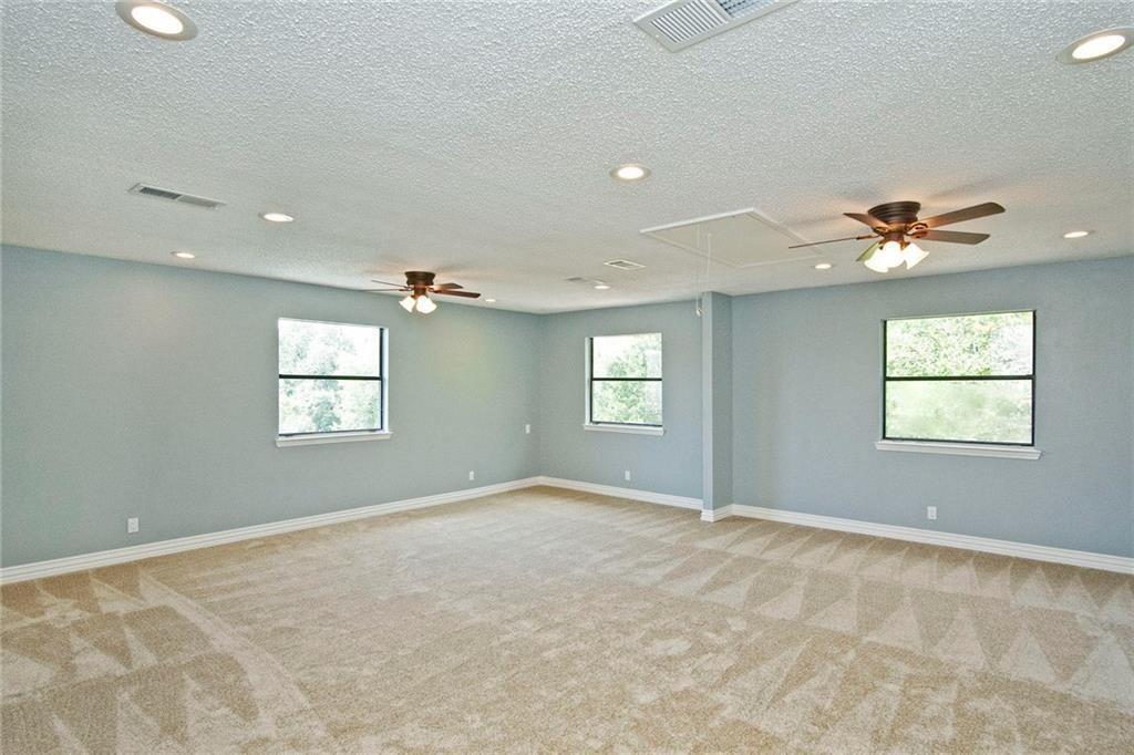 2509 Country Valley Road Garland, TX 75041 - Photo 13 of 17 Empty room with ceiling fan, plenty of natural light, recessed lighting, light carpet, and a textured ceiling