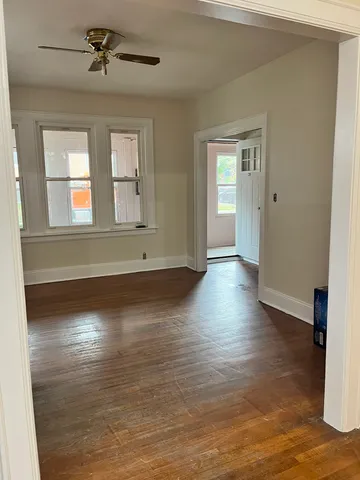 a view of room with window and hardwood floor