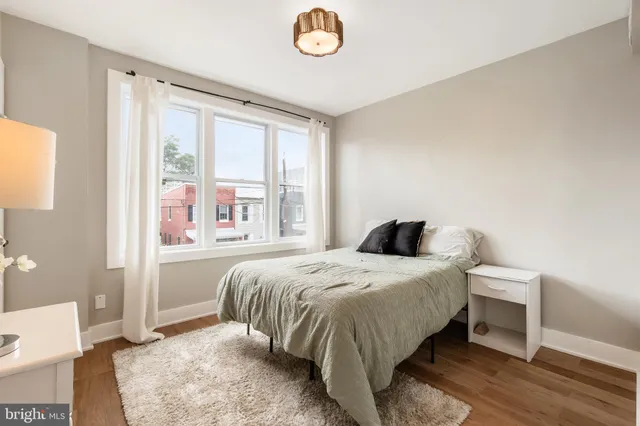 a bedroom with a bed and cabinets