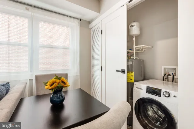 a view of walk in closet with wooden floor