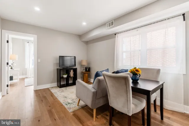 a large bedroom with a bed and a couch