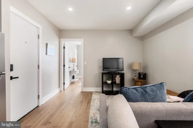 a kitchen with stainless steel appliances white cabinets and a stove