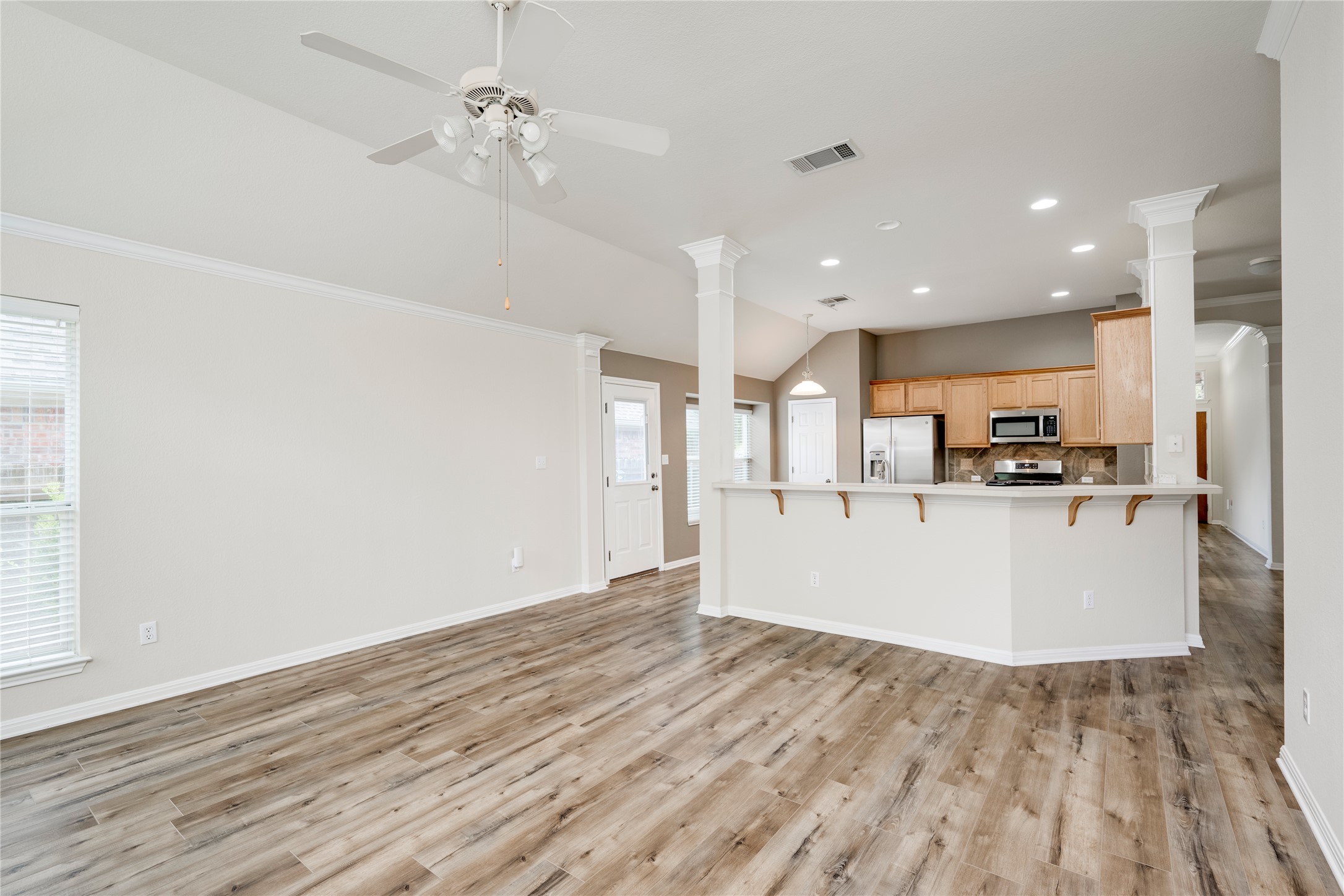 1813 Nelson Ranch Loop Cedar Park, TX 78613 - Photo 39 of 39 An open floor plan with hardwood flooring flows into a well-appointed kitchen.