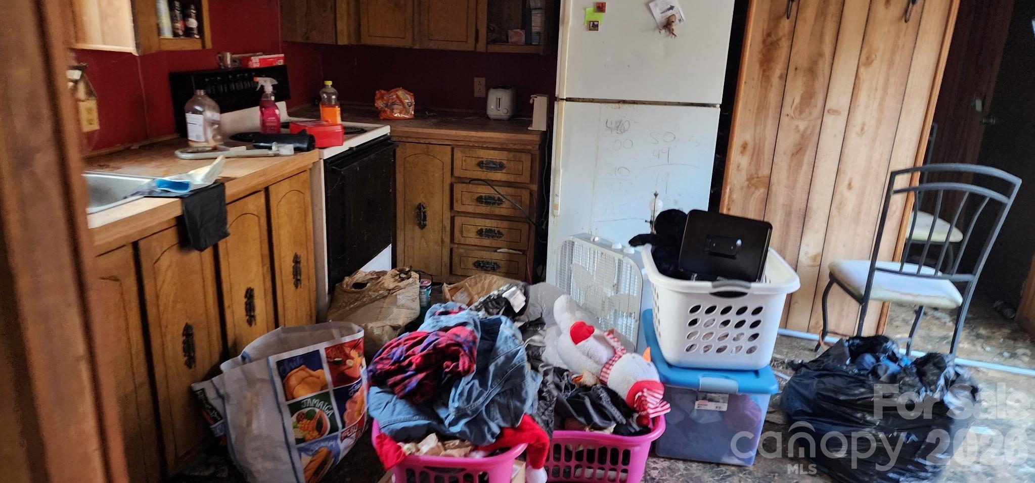 1142 Hidden View Loop Marion, NC 28752 - Photo 4 of 16 a view of walk in closet with clothes shoes and a mirror