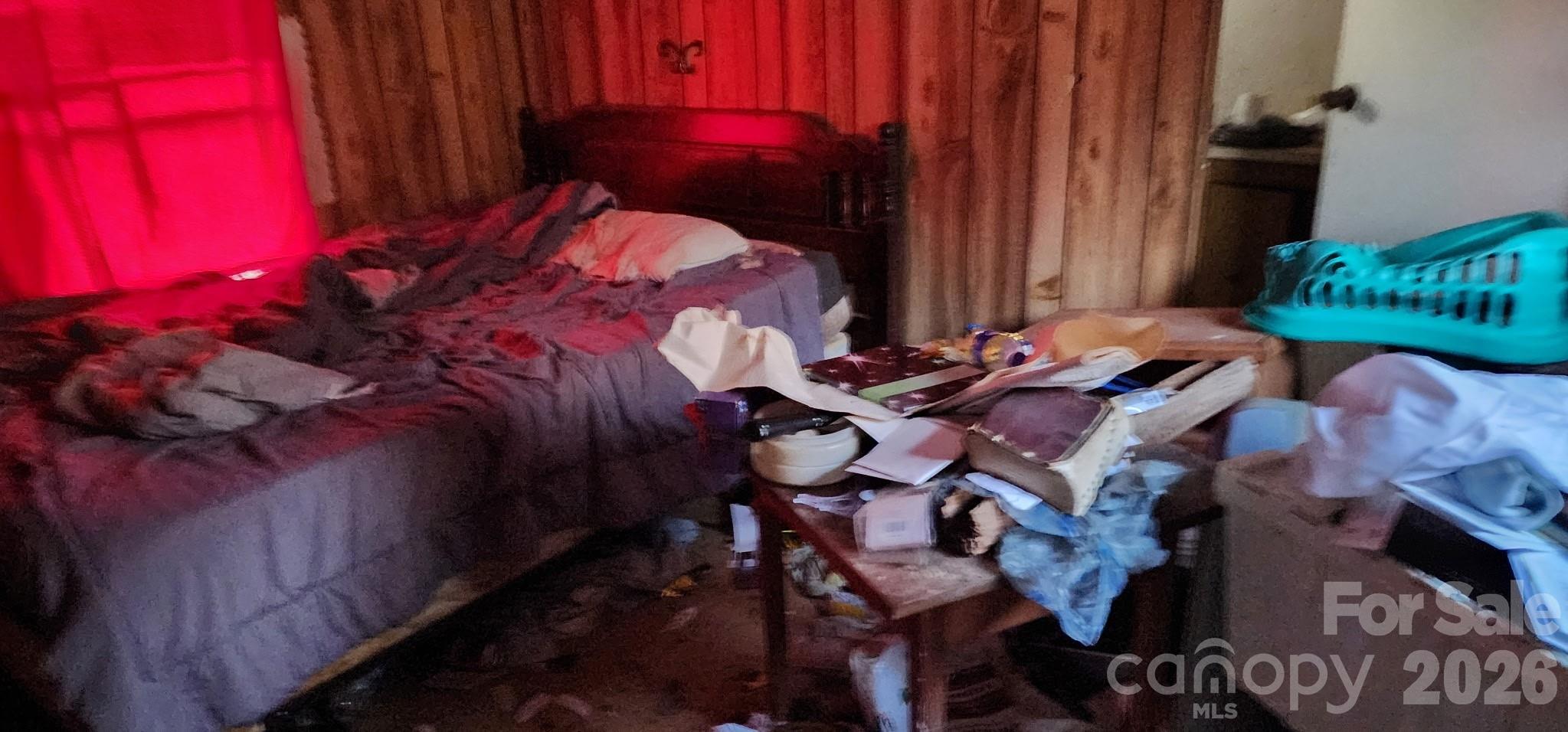 1142 Hidden View Loop Marion, NC 28752 - Photo 7 of 16 a bed sitting in a bedroom next to a window