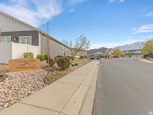 12214 Sunpark Lane Draper, UT 84020 - Photo 24 of 24 View of asphalt street with a residential view, sidewalks, curbs, and a mountain view