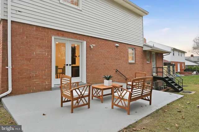 a backyard of a house with outdoor seating