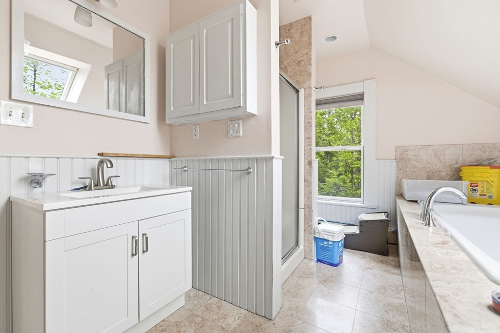 17 Wellesley Street Weston, MA 02493 - Photo 23 of 30 a bathroom with a sink a toilet and shower