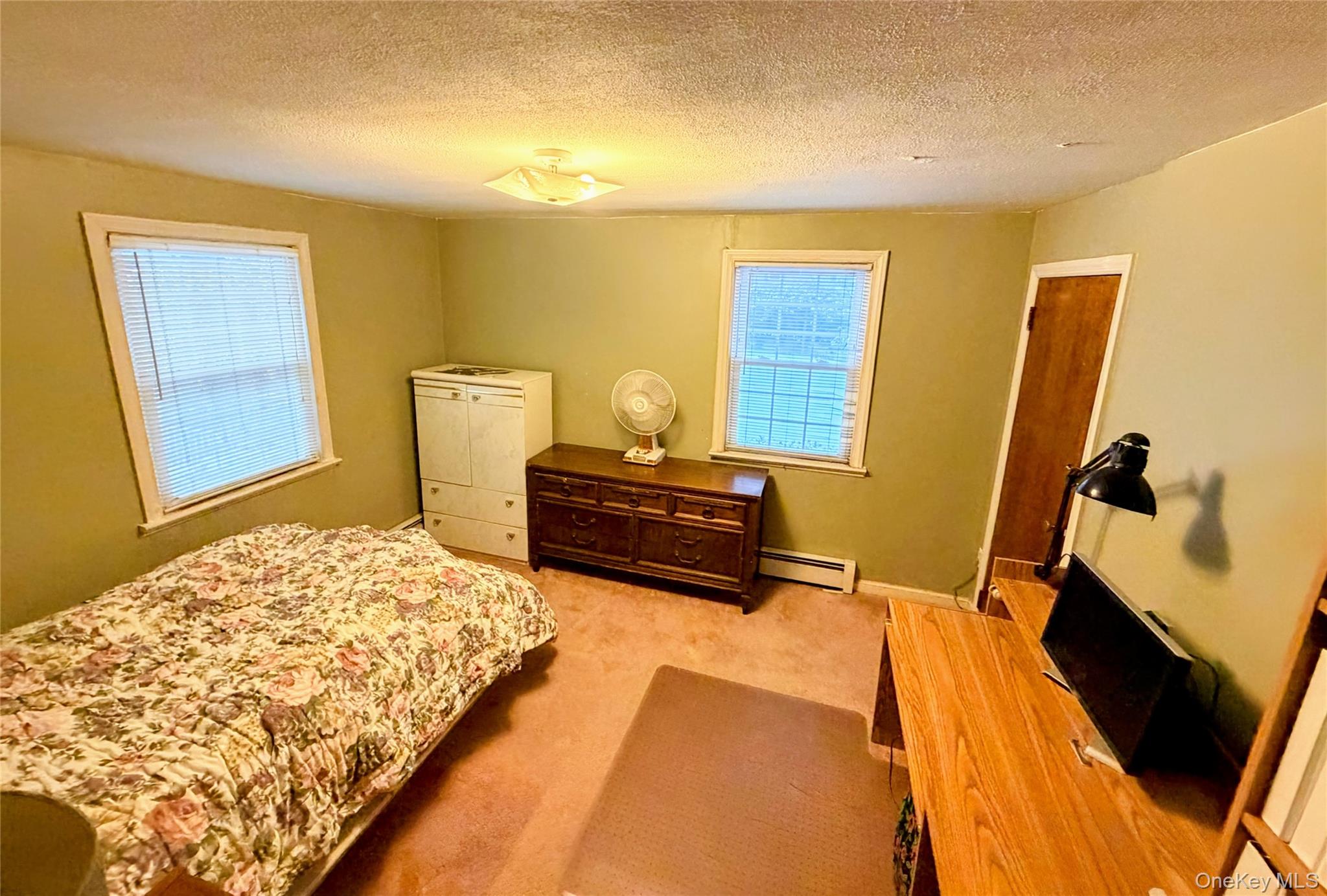 537 Ryders Lane East Brunswick, NJ 08816 - Photo 12 of 13 a bedroom with a bed and wooden floor