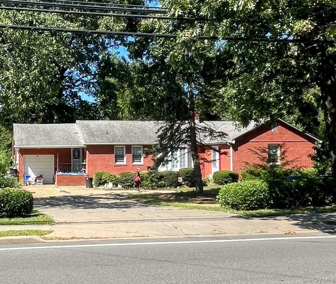 537 Ryders Lane East Brunswick, NJ 08816 - Photo 2 of 13 front view of a house with a street