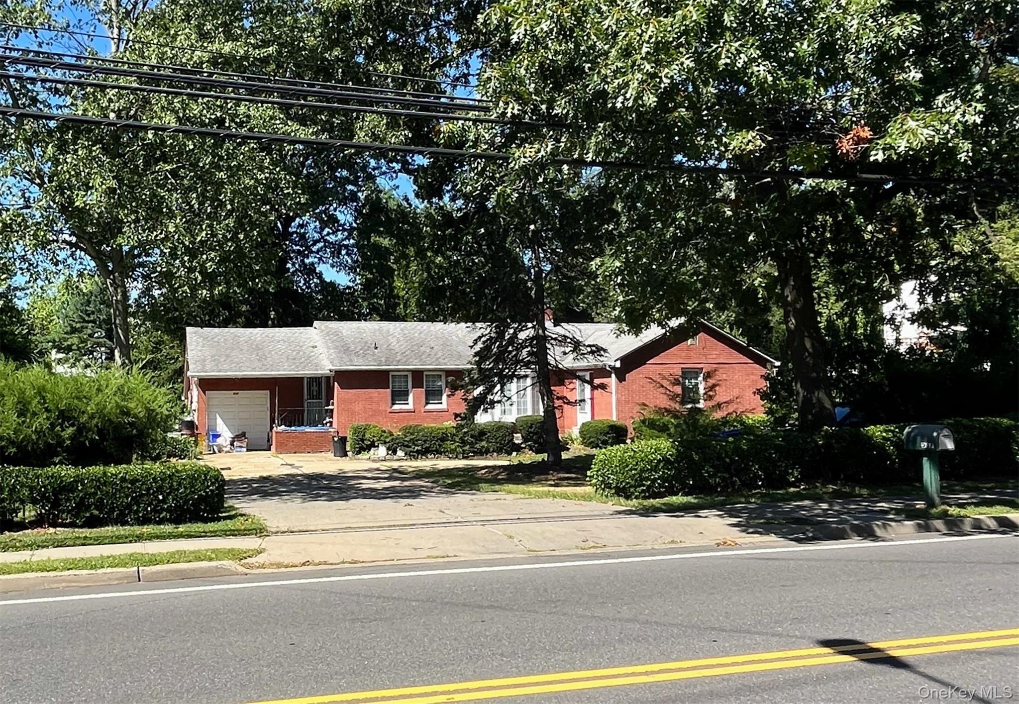 537 Ryders Lane East Brunswick, NJ 08816 - Photo 4 of 13 a front view of a house with a garden