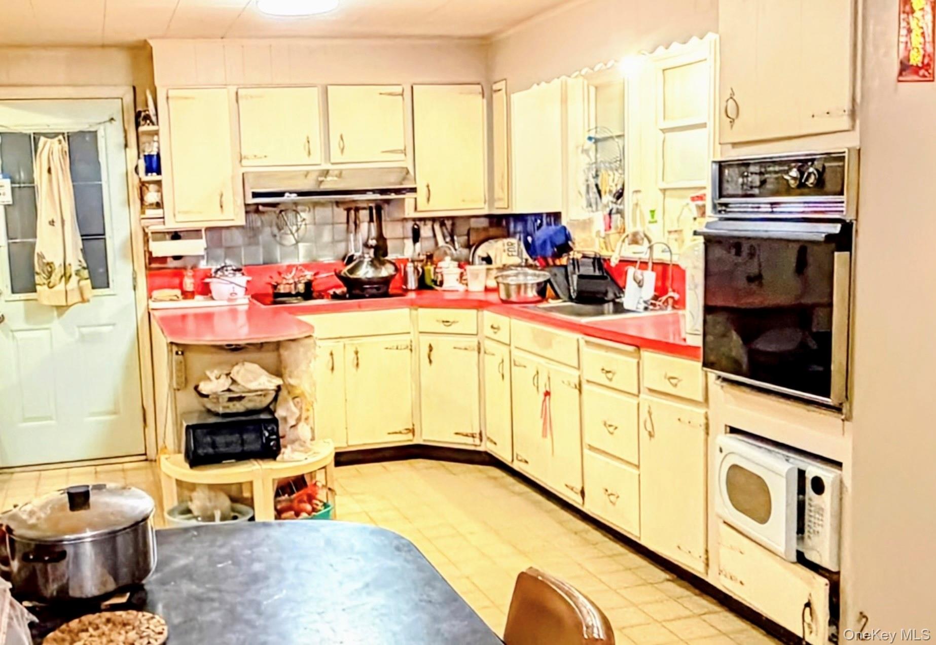 537 Ryders Lane East Brunswick, NJ 08816 - Photo 6 of 13 a kitchen with stainless steel appliances kitchen island granite countertop a stove and a refrigerator