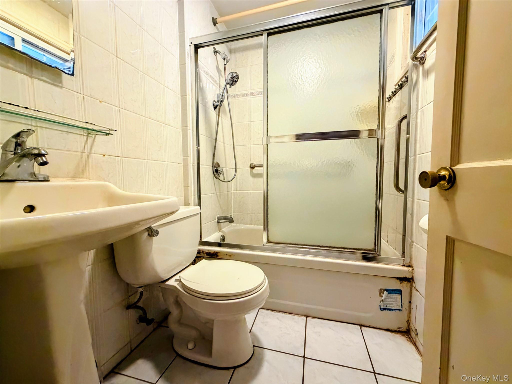 537 Ryders Lane East Brunswick, NJ 08816 - Photo 9 of 13 a bathroom with a sink a toilet and a shower