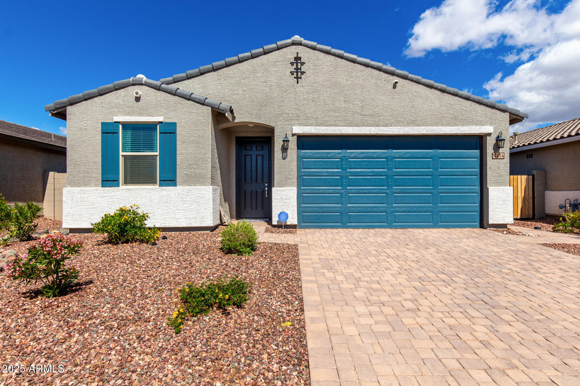 17454 West Red Fox Road Surprise, AZ 85387 - Photo 1 of 28 a front view of a house with a yard and garage