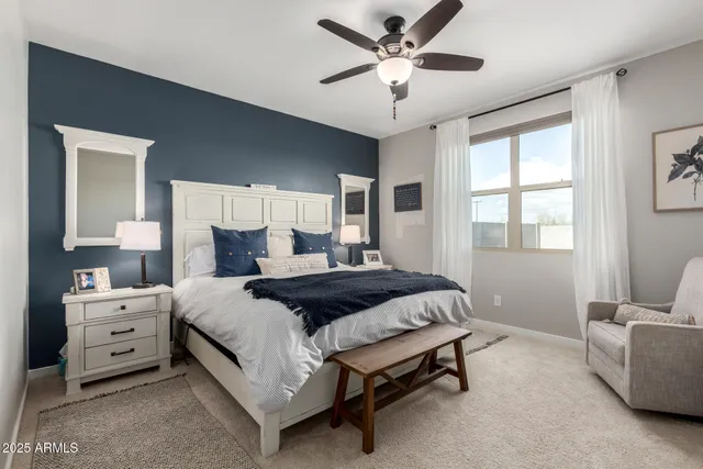 a bedroom with a bed and window