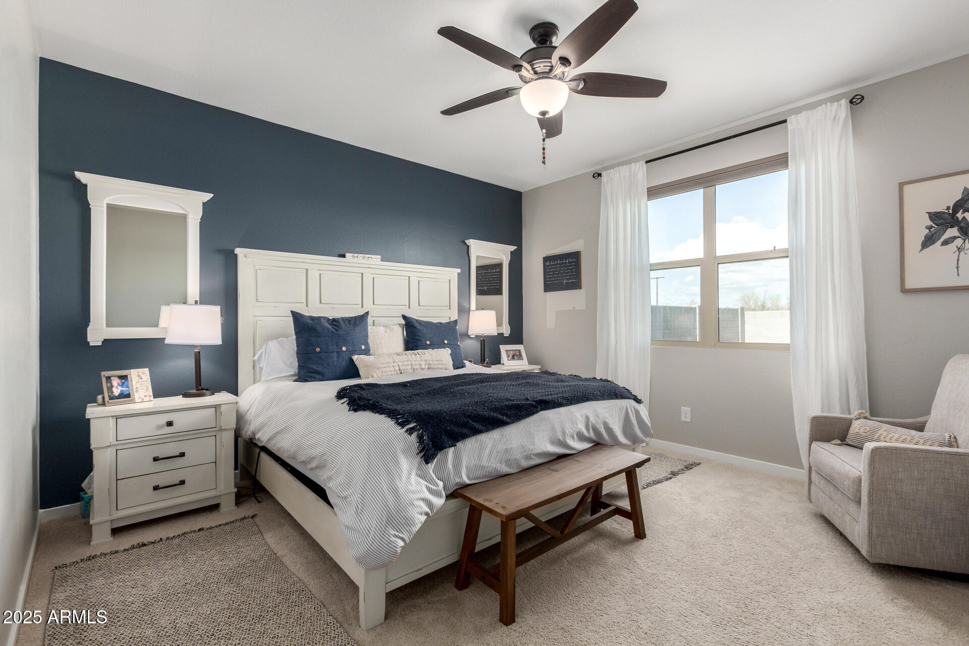 17454 West Red Fox Road Surprise, AZ 85387 - Photo 11 of 28 a bedroom with a bed and window