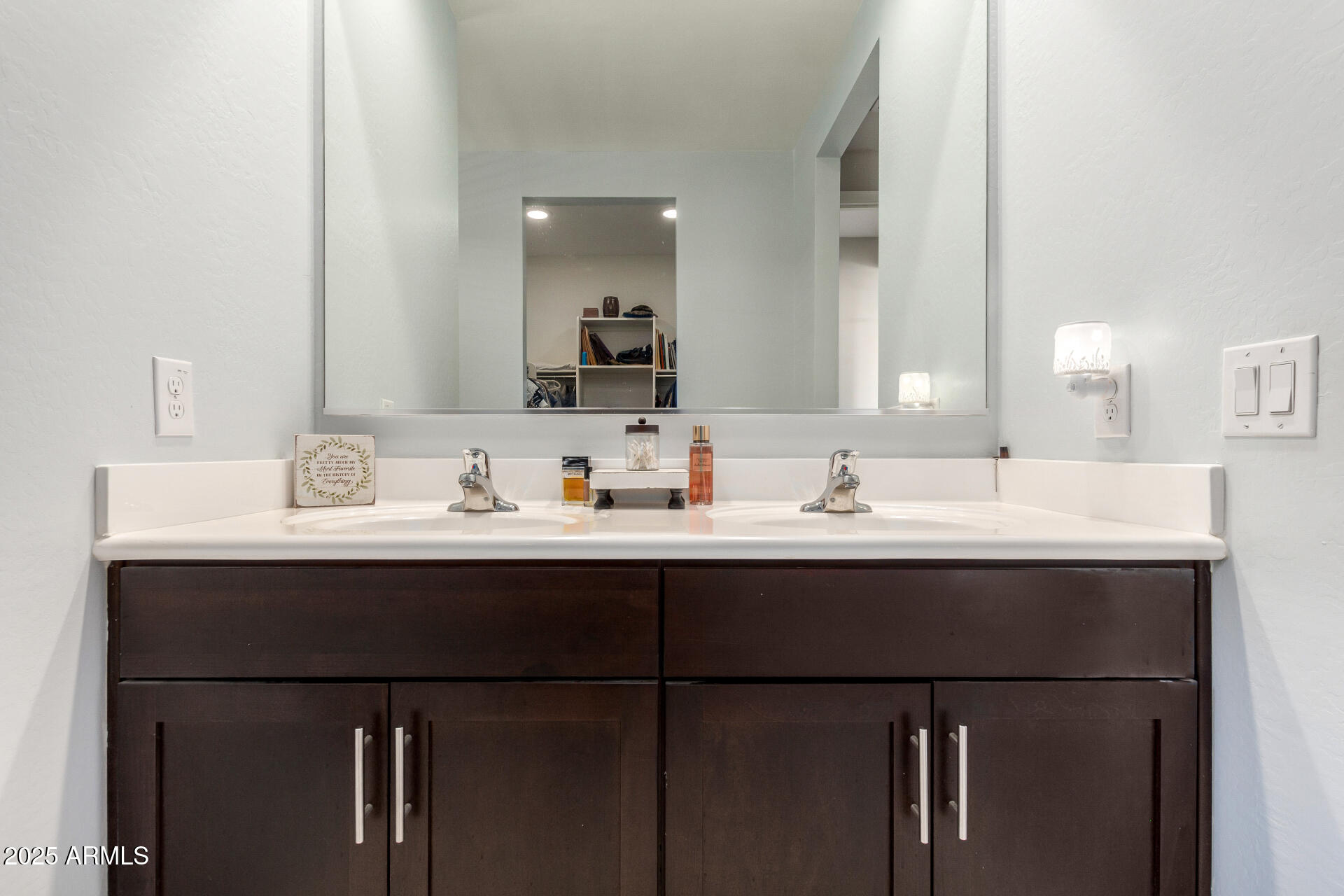 17454 West Red Fox Road Surprise, AZ 85387 - Photo 14 of 28 a bathroom with a sink and a mirror