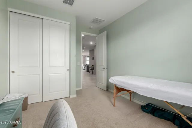 a room that has a bed and a table in it