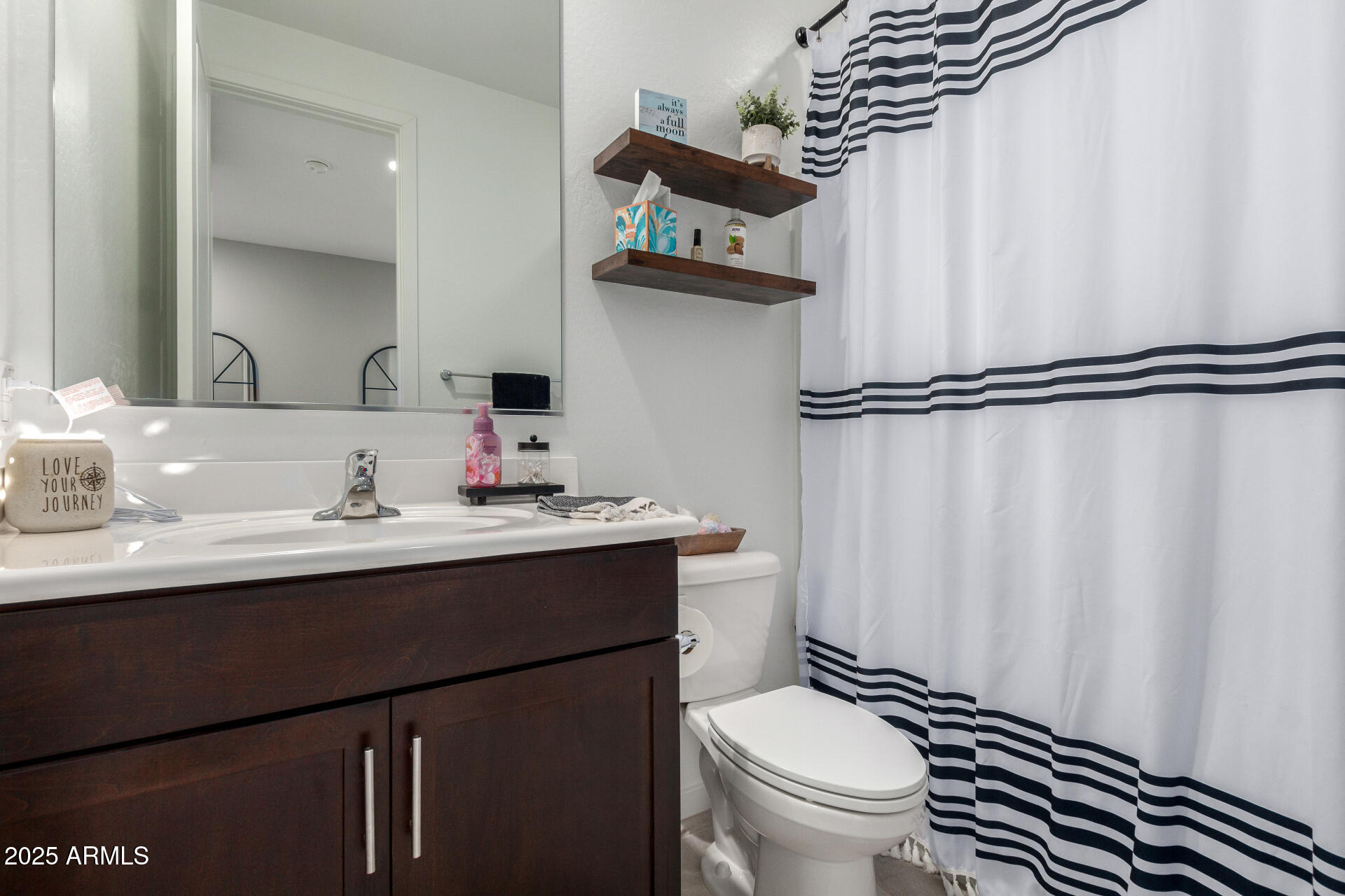 17454 West Red Fox Road Surprise, AZ 85387 - Photo 21 of 28 a bathroom with a sink toilet and shower