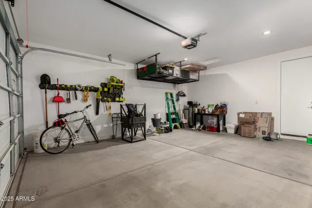 a view of a garage with a bike and white walls