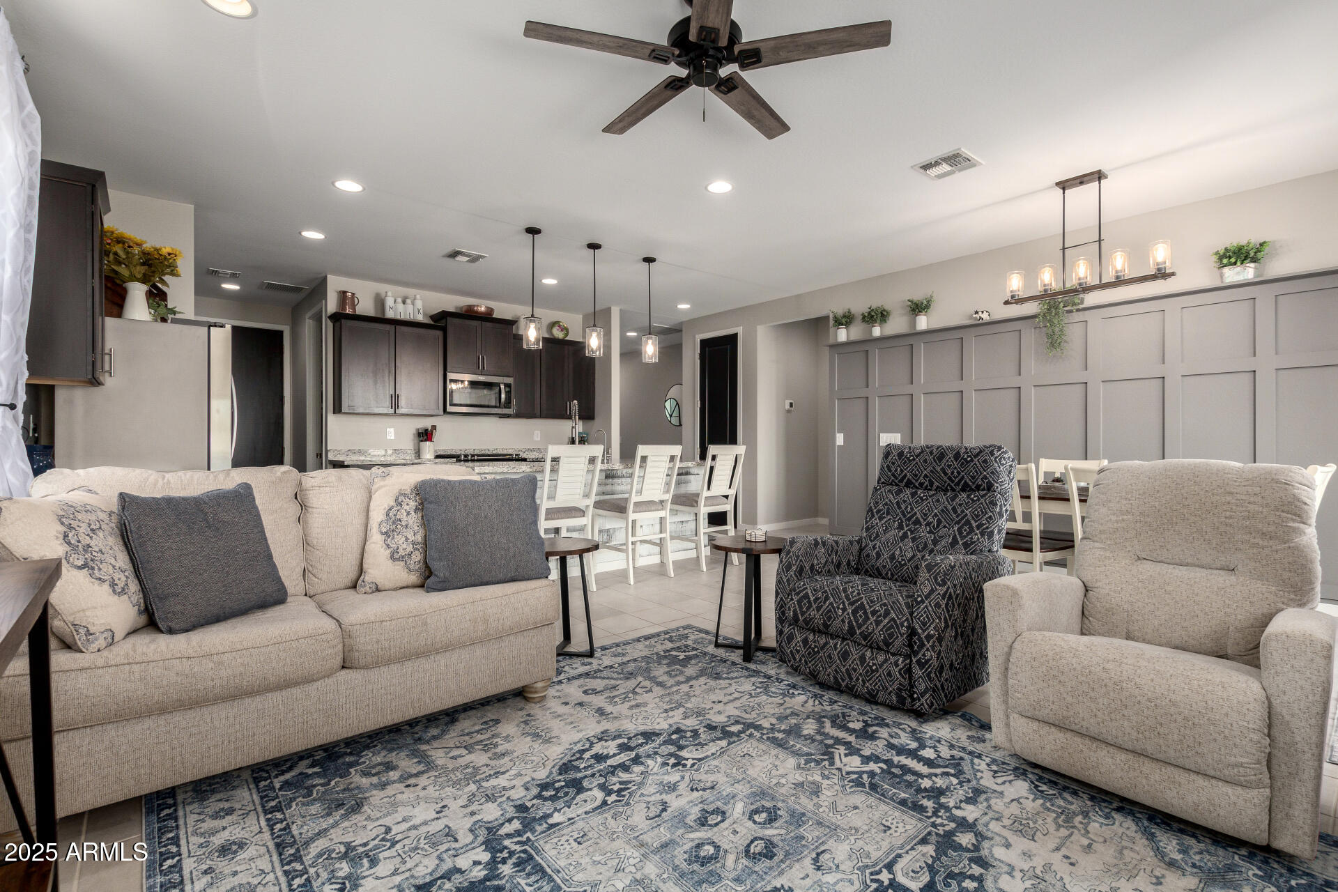 17454 West Red Fox Road Surprise, AZ 85387 - Photo 9 of 28 a living room with furniture and kitchen view