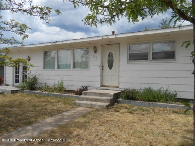 536 East 12th Street Rifle, CO 81650 - Photo 1 of 18 a front view of a house with a yard