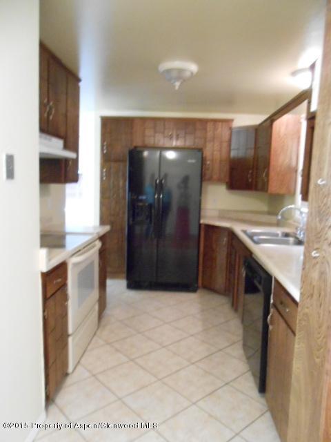536 East 12th Street Rifle, CO 81650 - Photo 12 of 18 a large kitchen with a stove a sink and a refrigerator