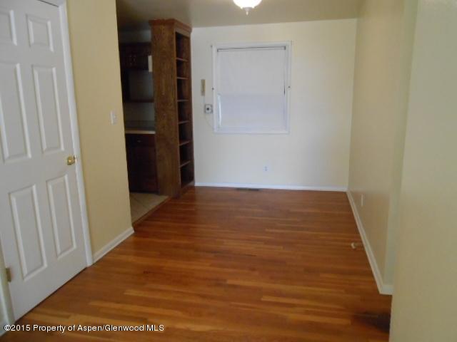 536 East 12th Street Rifle, CO 81650 - Photo 13 of 18 a view of a hallway with wooden floor