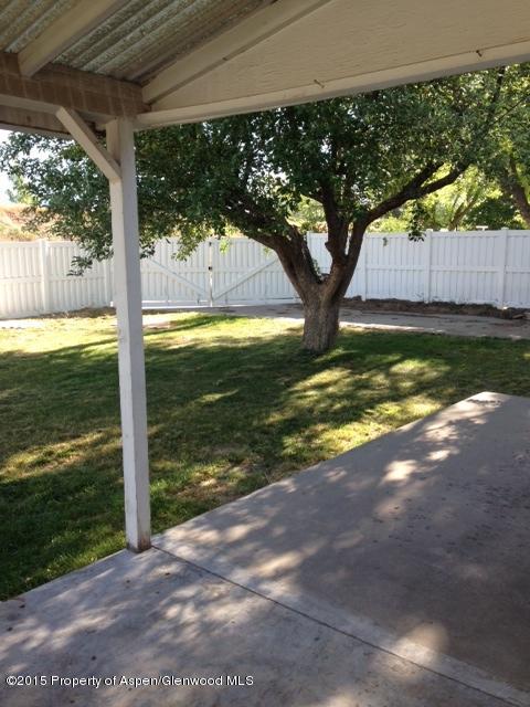 536 East 12th Street Rifle, CO 81650 - Photo 3 of 18 a view of a trees and yard in front of a house