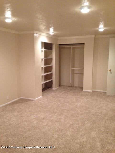 536 East 12th Street Rifle, CO 81650 - Photo 5 of 18 a view of an empty room with a closet and a cabinet