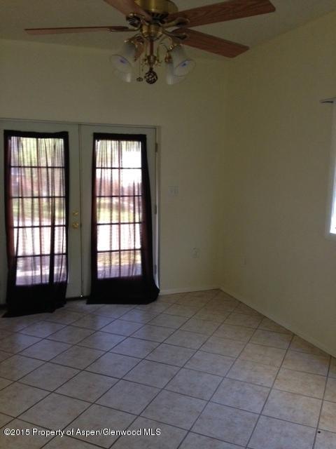 536 East 12th Street Rifle, CO 81650 - Photo 6 of 18 a view of an empty room with a window