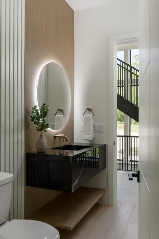 a view of an entryway with wooden floor